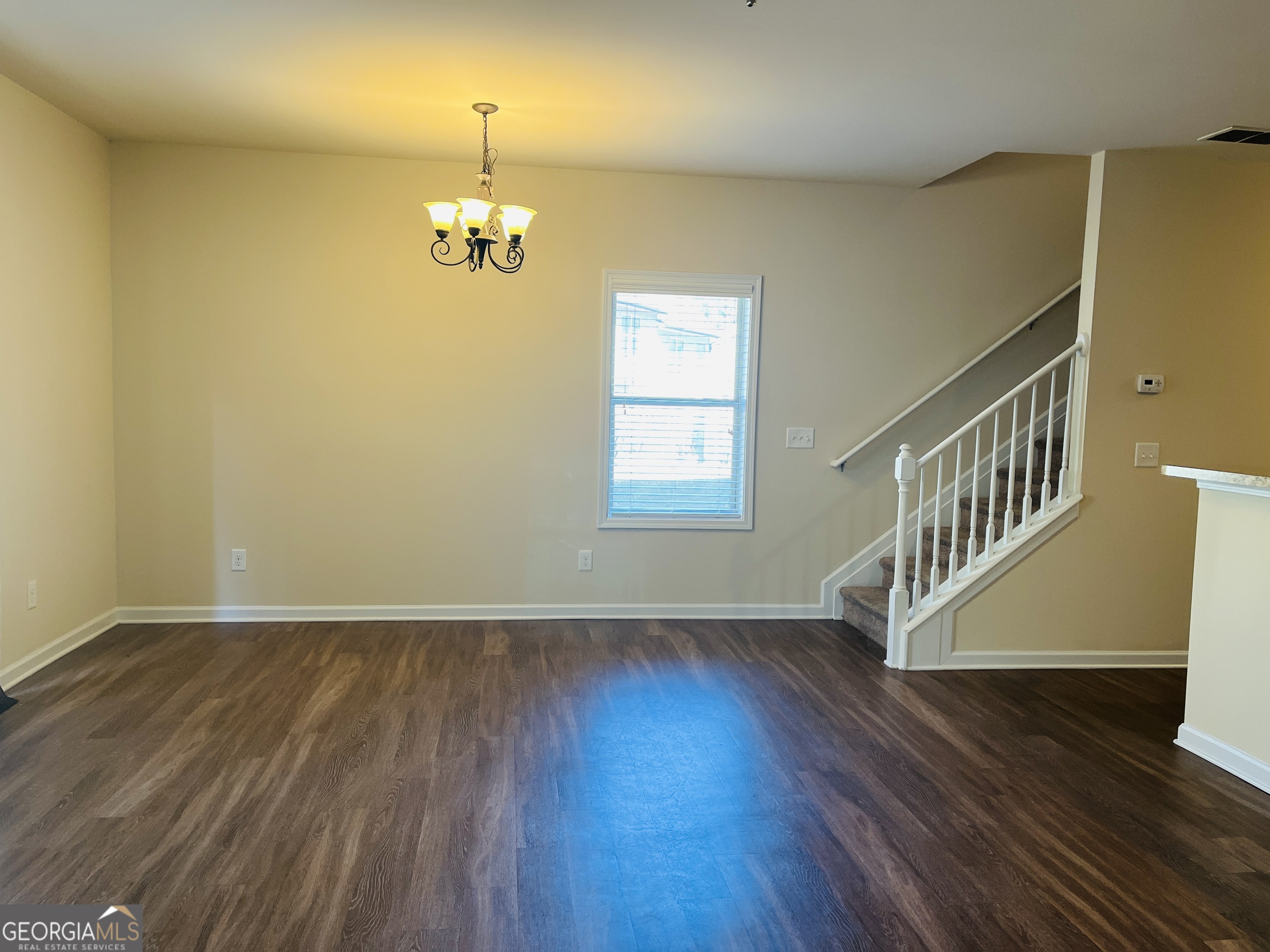 233 Bobbie Way Woodstock, GA 30189 - Photo 9 of 32 a view of an entryway with wooden floor