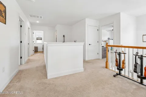 a view of hallway with washer and dryer