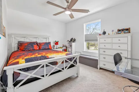 a bed room with a bed and a baby bed