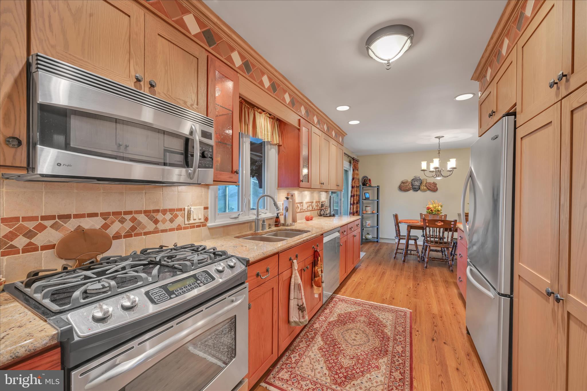 2295 Albern Boulevard Lancaster, PA 17601 - Photo 13 of 39 a kitchen with stove and chairs