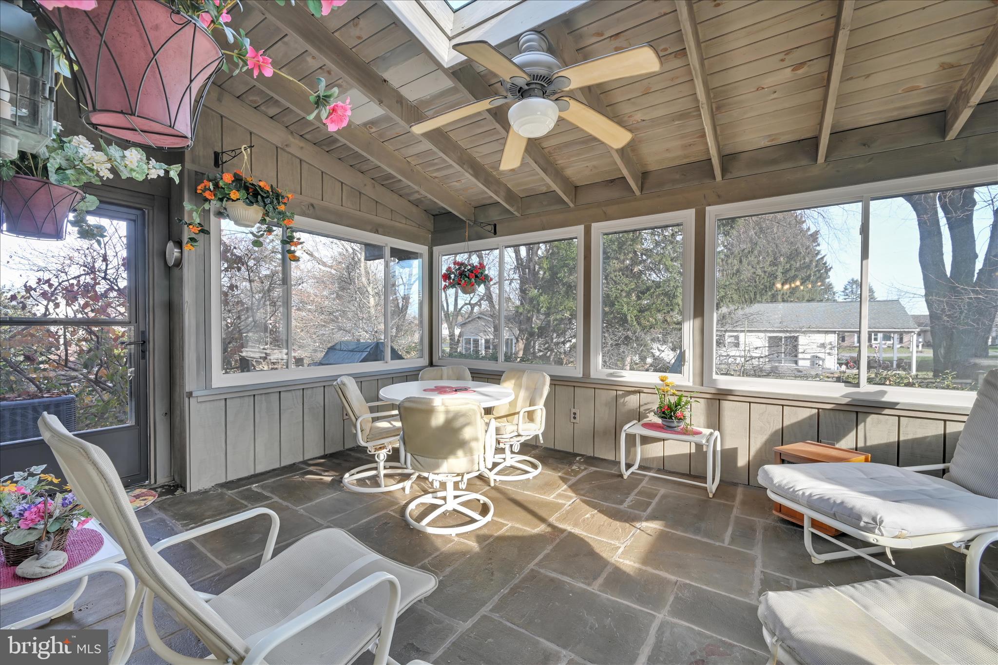 2295 Albern Boulevard Lancaster, PA 17601 - Photo 15 of 39 a living room with patio furniture and a floor to ceiling window