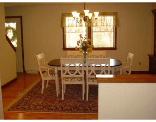 24 Merrill Road Wilbraham, MA 01095 - Photo 5 of 7 a dining room with furniture a chandelier and wooden floor