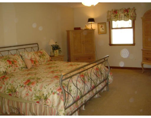 24 Merrill Road Wilbraham, MA 01095 - Photo 7 of 7 a bed sitting in a bathroom next to a window