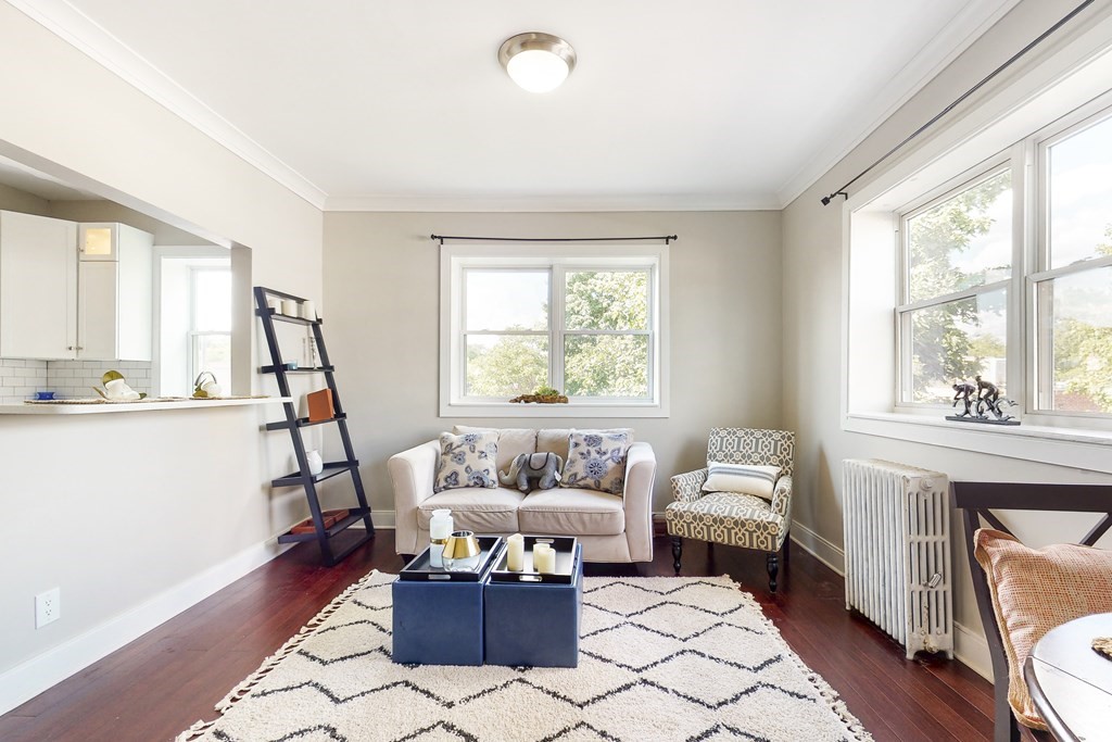 1834 Beacon Street, Unit 16 Brookline, MA 02445 - Photo 12 of 21 a living room with furniture and a window