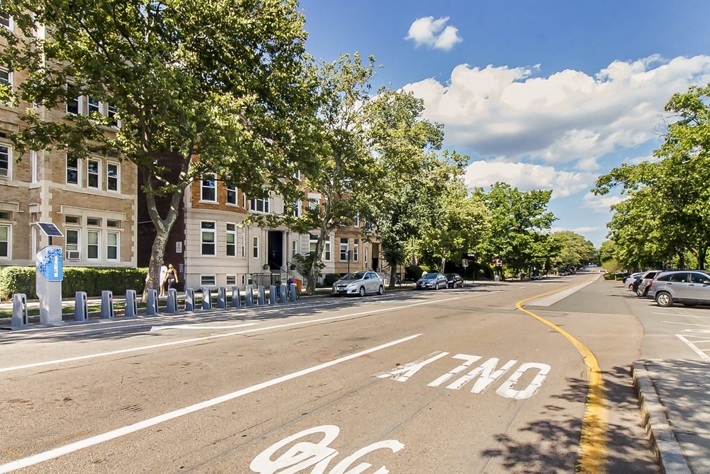 1834 Beacon Street, Unit 16 Brookline, MA 02445 - Photo 21 of 21 a building with trees in front of it