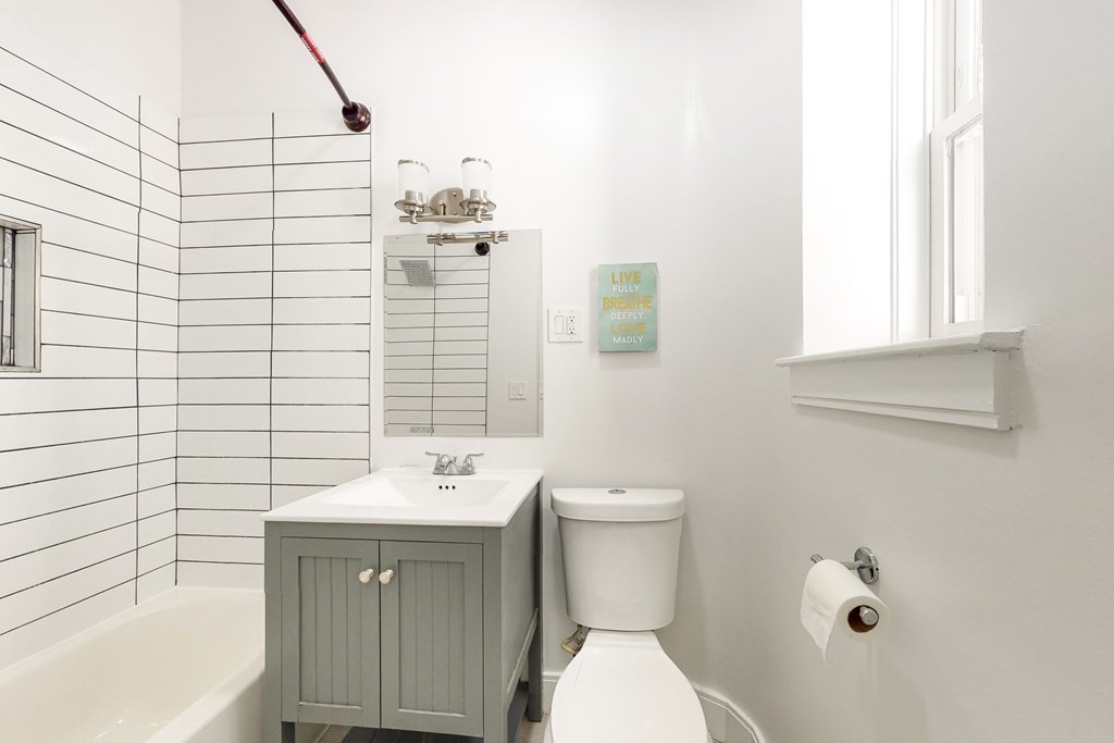 1834 Beacon Street, Unit 16 Brookline, MA 02445 - Photo 6 of 21 a bathroom with a sink a toilet and shower