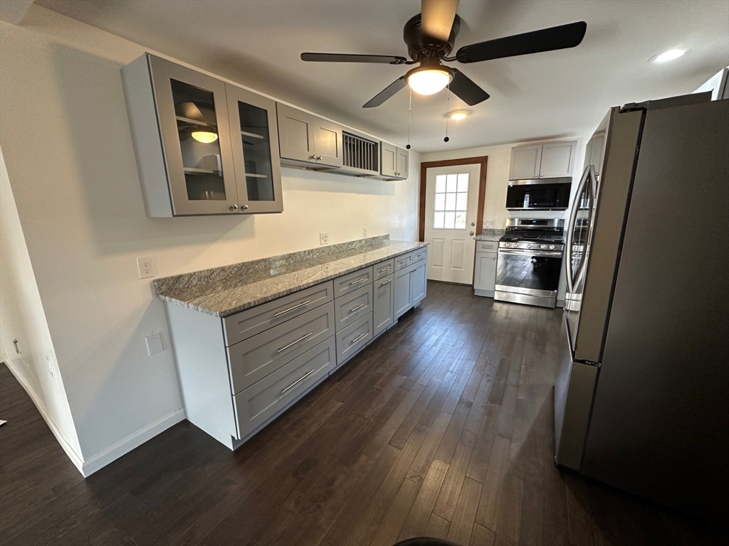 52 Valley Road Southampton, MA 01073 - Photo 11 of 18 a kitchen with stainless steel appliances granite countertop a refrigerator a oven a stove and a refrigerator