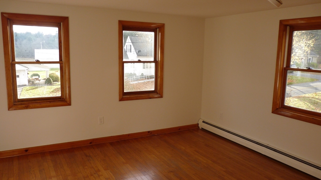 52 Valley Road Southampton, MA 01073 - Photo 16 of 18 an empty room with wooden floor and windows