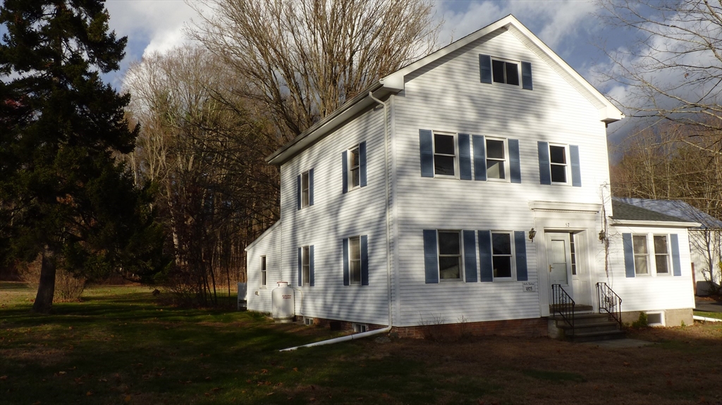 52 Valley Road Southampton, MA 01073 - Photo 2 of 18 a front view of a house with a yard