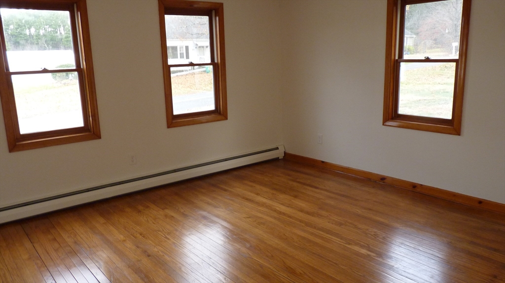 52 Valley Road Southampton, MA 01073 - Photo 8 of 18 an empty room with wooden floor and windows
