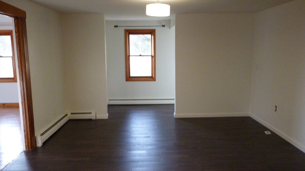 52 Valley Road Southampton, MA 01073 - Photo 9 of 18 an empty room with wooden floor and windows
