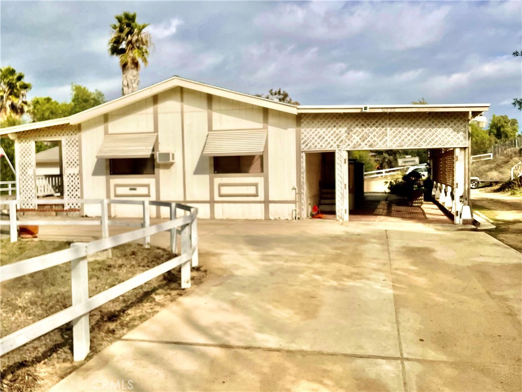 32850 Daily Road Menifee, CA 92584 - Photo 1 of 1 a view of a swimming pool with a chair and floor to ceiling window