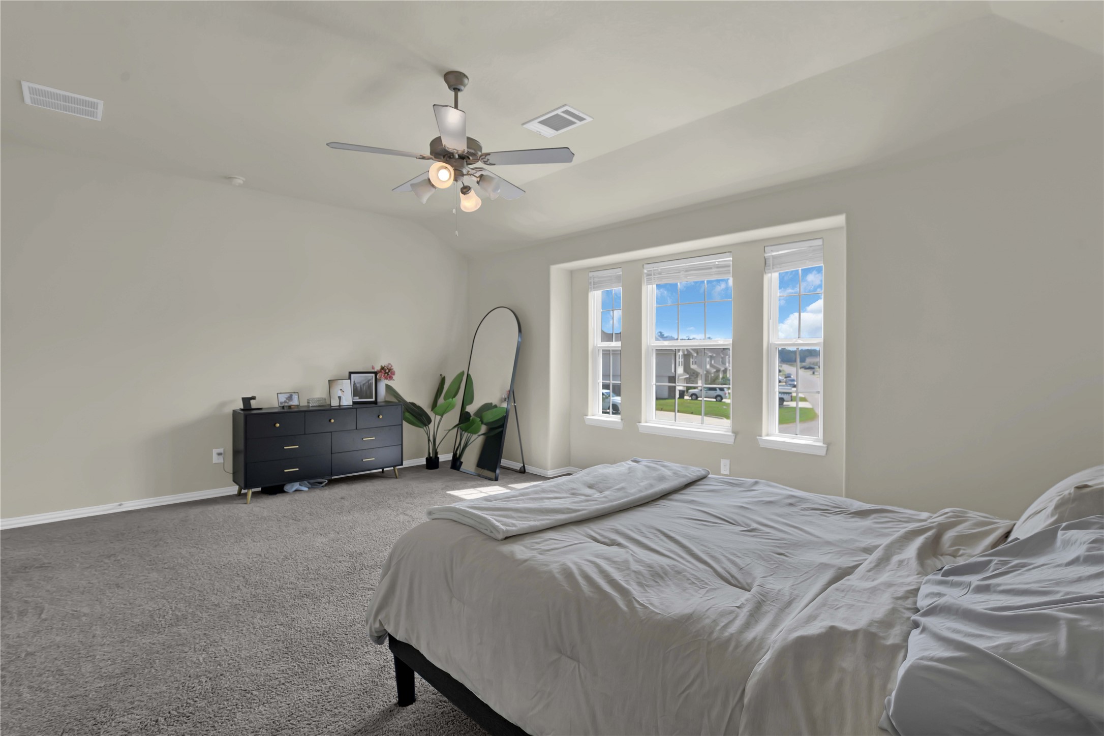 17703 Lion Heart Road Conroe, TX 77306 - Photo 15 of 26 a bedroom with a bed and a large window
