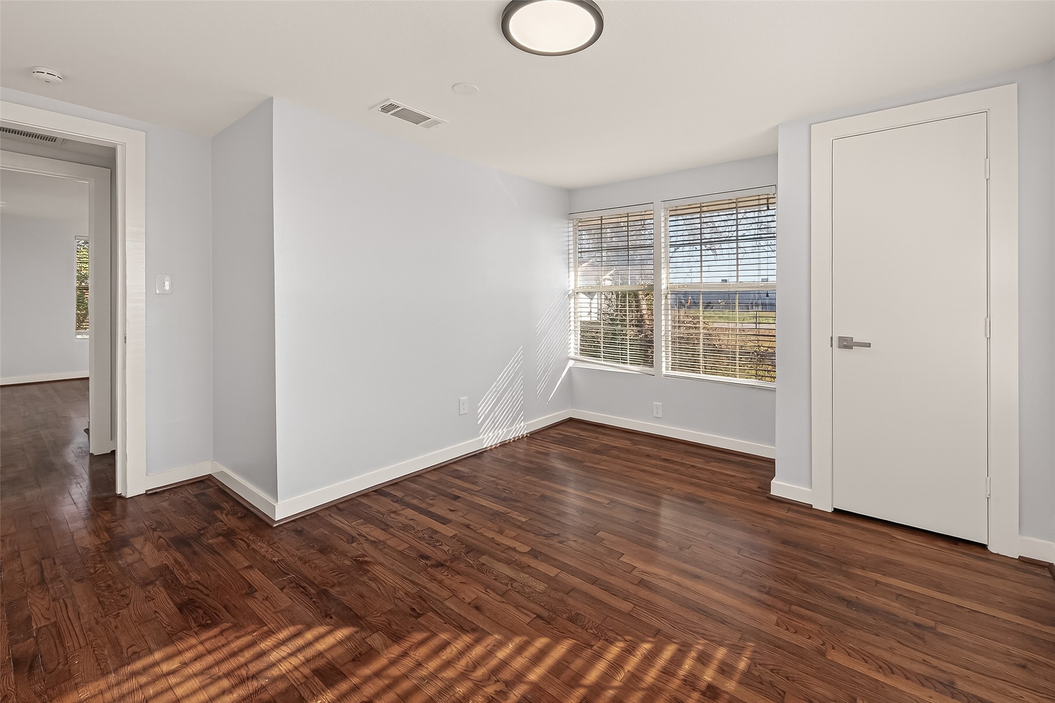 754 Prosper Street Houston, TX 77088 - Photo 15 of 28 a view of empty room with wooden floor and fan