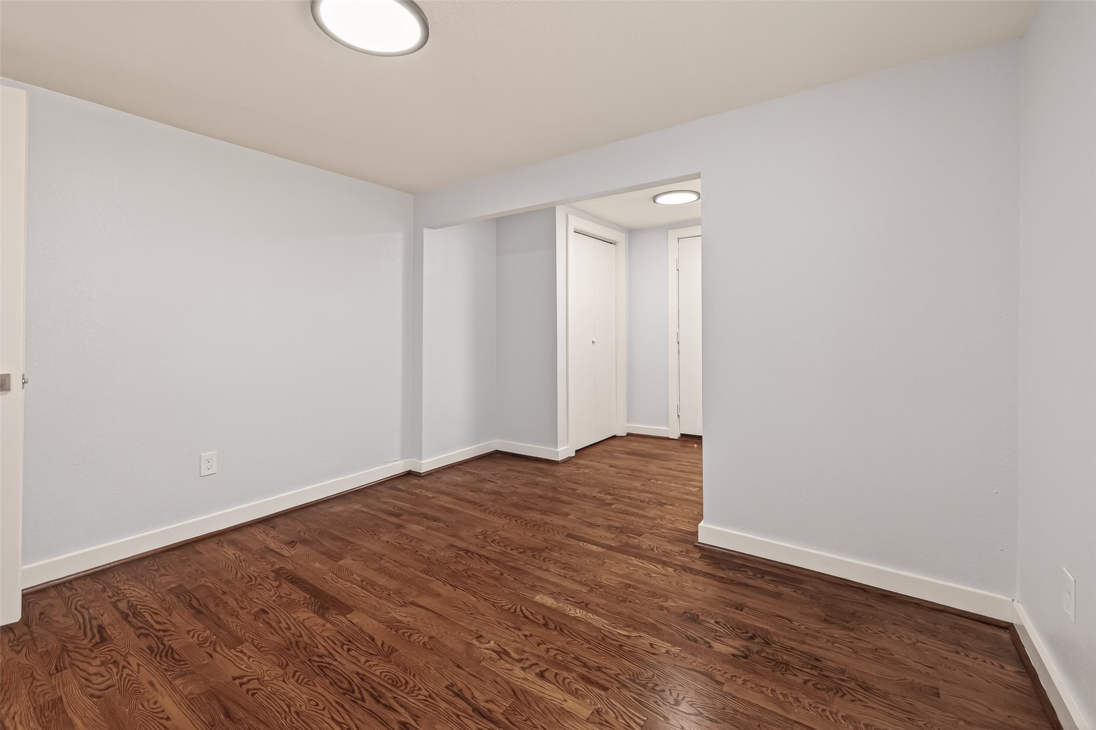754 Prosper Street Houston, TX 77088 - Photo 18 of 28 a view of an empty room with wooden floor