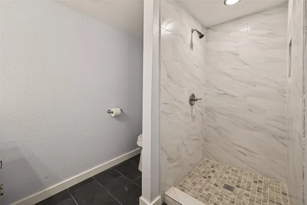 a bathroom with a sink vanity and a mirror