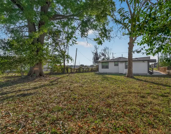 a view of a back yard of the house