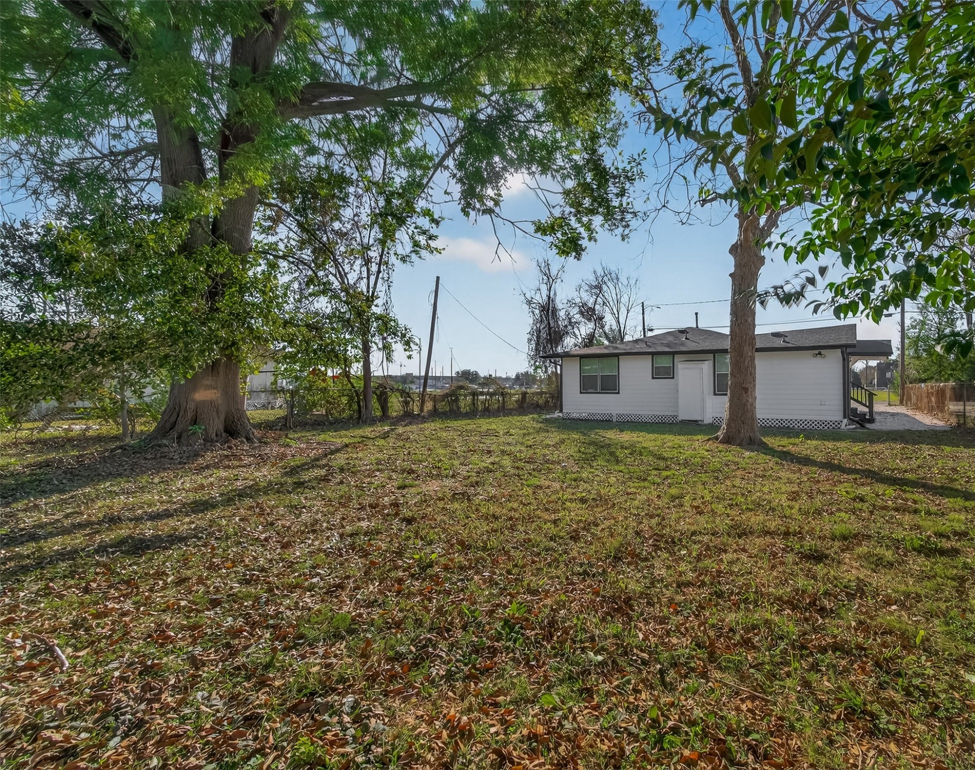 754 Prosper Street Houston, TX 77088 - Photo 26 of 28 a view of a house with a yard