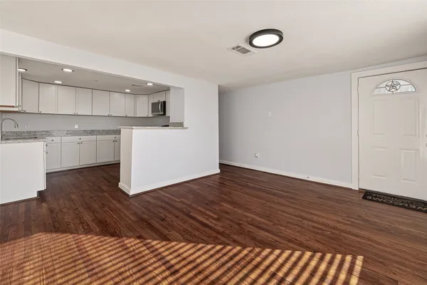 a kitchen with a sink and a stove top oven