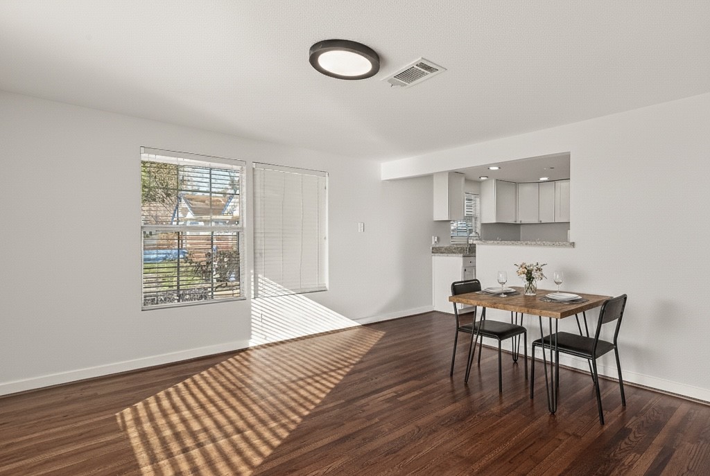 754 Prosper Street Houston, TX 77088 - Photo 9 of 28 a view of a dining room with furniture and wooden floor