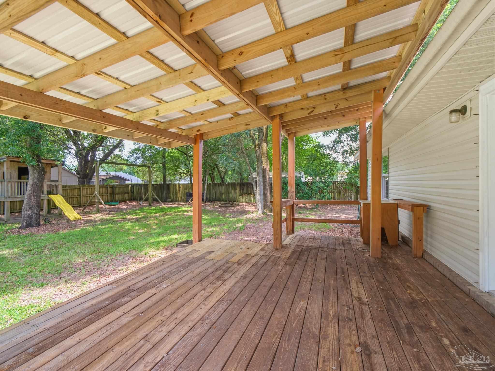 5567 Jones Street Milton, FL 32570 - Photo 42 of 48 a view of a room with wooden floor and roof