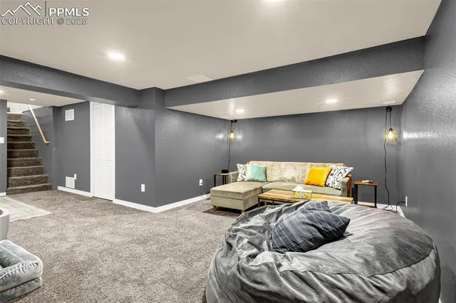 a bedroom with a bed and ceiling fan