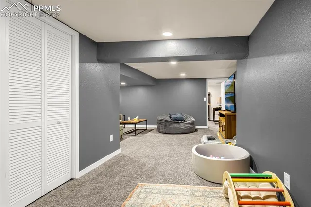 a bathroom with a toilet a sink and a mirror