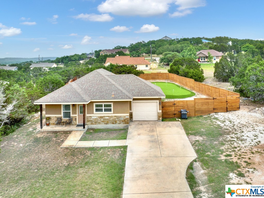 250 Rocky Ranch Road Canyon Lake, TX 78133 - Photo 1 of 1 a front view of a house with yard