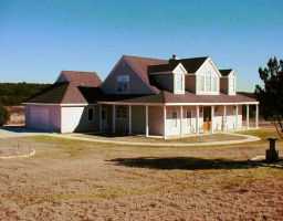 865 Bell Springs Road Dripping Springs, TX 78620 - Photo 1 of 1 a front view of a house with a yard