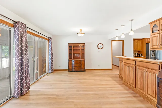 a spacious bathroom with a sink and a mirror