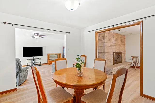 a spacious bedroom with a bed and large windows