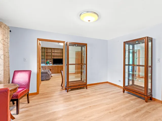 a bedroom with a bed chair and a large window