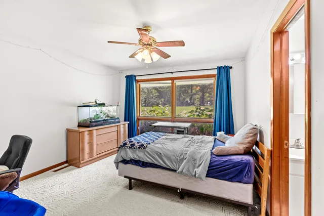 a bathroom with a sink a toilet and vanity