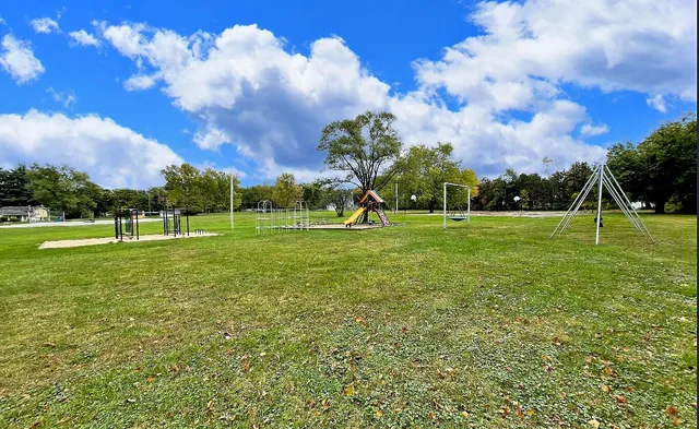 a view of outdoor space with garden and trees