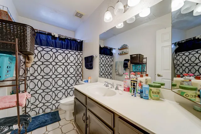 a kitchen with a sink a stove and cabinets