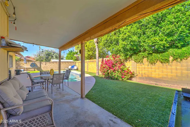 a view of a swimming pool with a patio