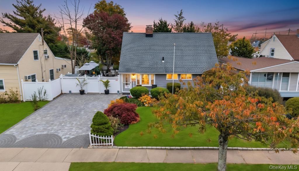 101 Constellation Road Levittown, NY 11756 - Photo 1 of 1 View of front of property featuring a chimney, a gate, a shingled roof, and decorative driveway
