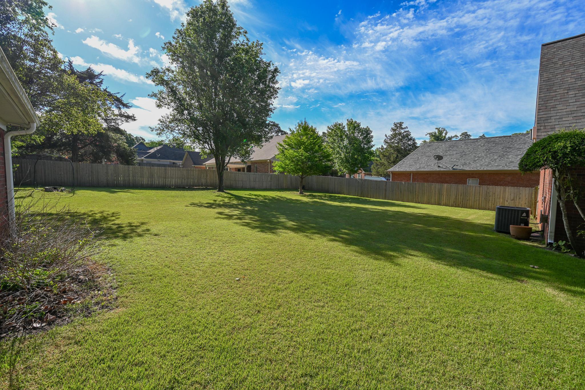 3746 Broadway Road Bartlett, TN 38135 - Photo 35 of 39 Beautiful backyard with wooden fence and established landscaping.