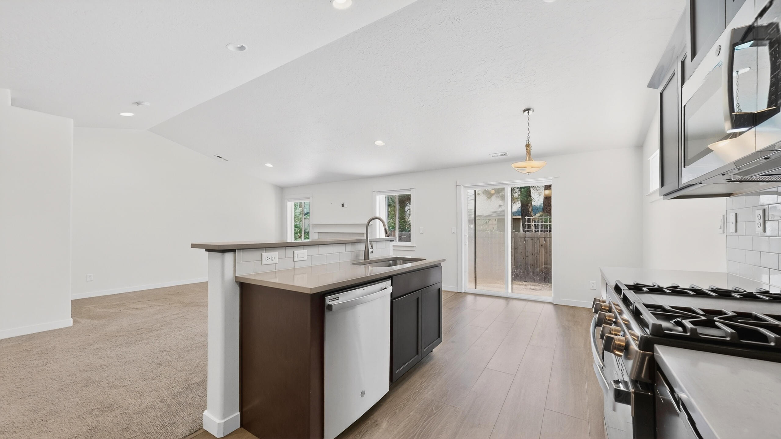 680 McKinney Ranch Road Sisters, OR 97759 - Photo 22 of 41 a kitchen with stainless steel appliances granite countertop a stove and a sink