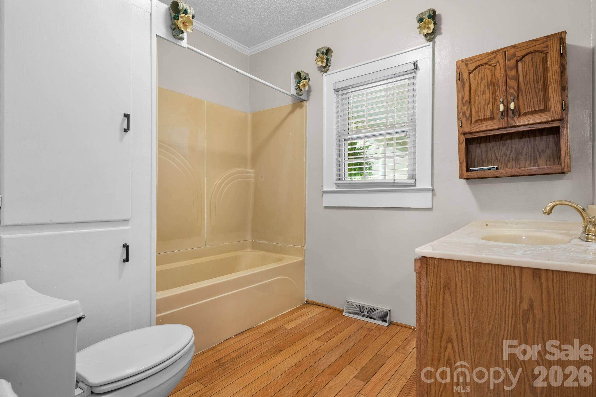 144 Hunter Bridge Road Stony Point, NC 28678 - Photo 19 of 45 a bathroom with a sink a toilet and shower