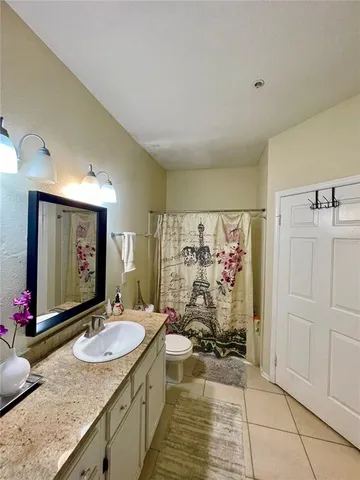 a bed room with a bed and a window