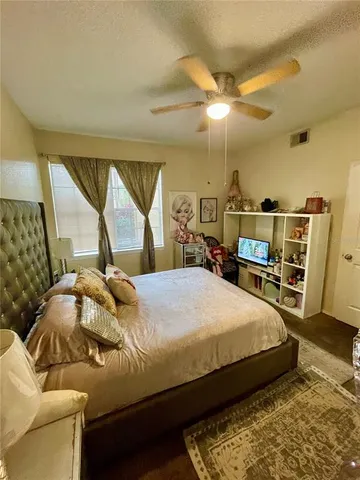 a view of walk in closet with clothes