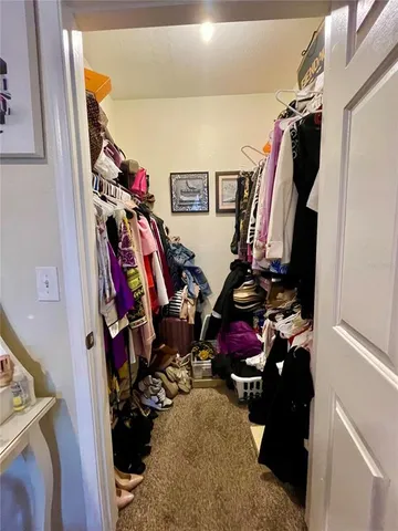 a view of bedroom with window and wardrobe