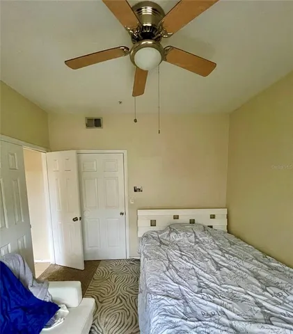 a utility room with closet dryer and washer