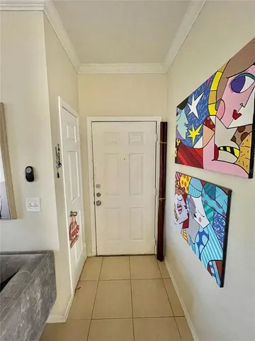 a view of an entryway with wooden floor