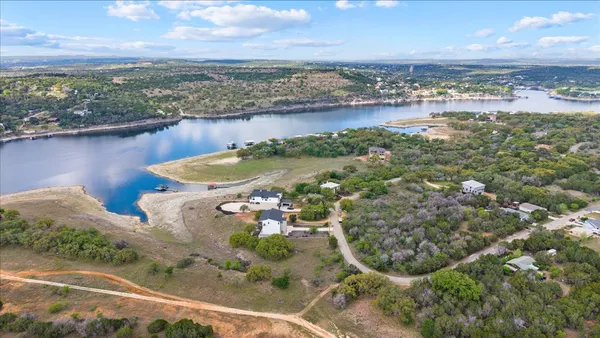 a view of a lake with a yard