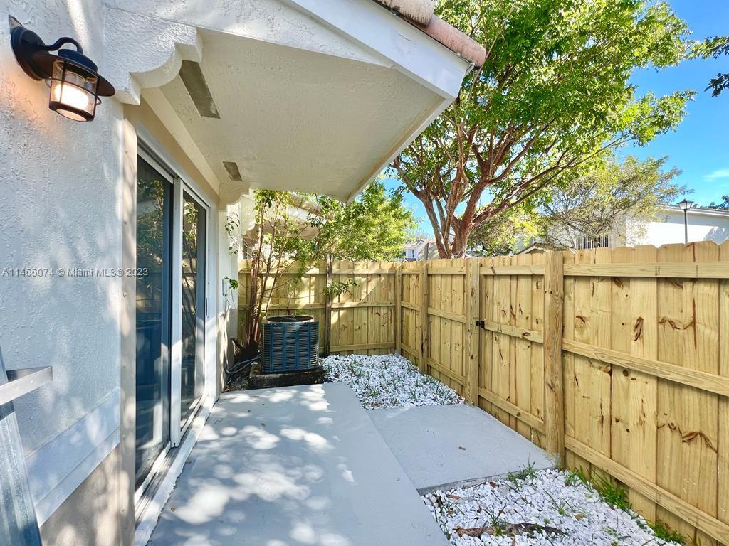 14116 Southwest 260th Street, Unit 106 Homestead, FL 33032 - Photo 20 of 24 a view of a garden