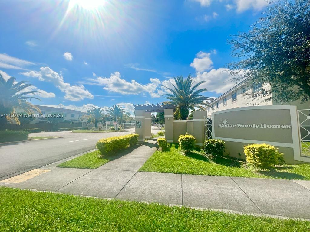 14116 Southwest 260th Street, Unit 106 Homestead, FL 33032 - Photo 4 of 24 a view of a garden