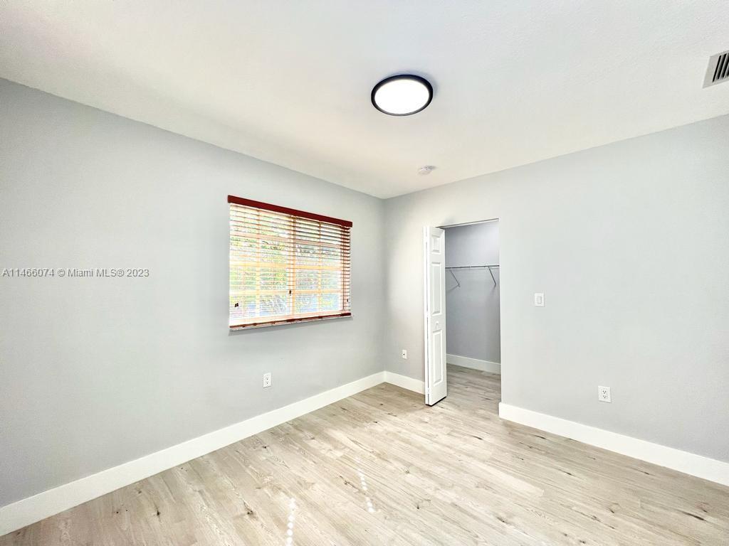 14116 Southwest 260th Street, Unit 106 Homestead, FL 33032 - Photo 8 of 24 a view of an empty room and window