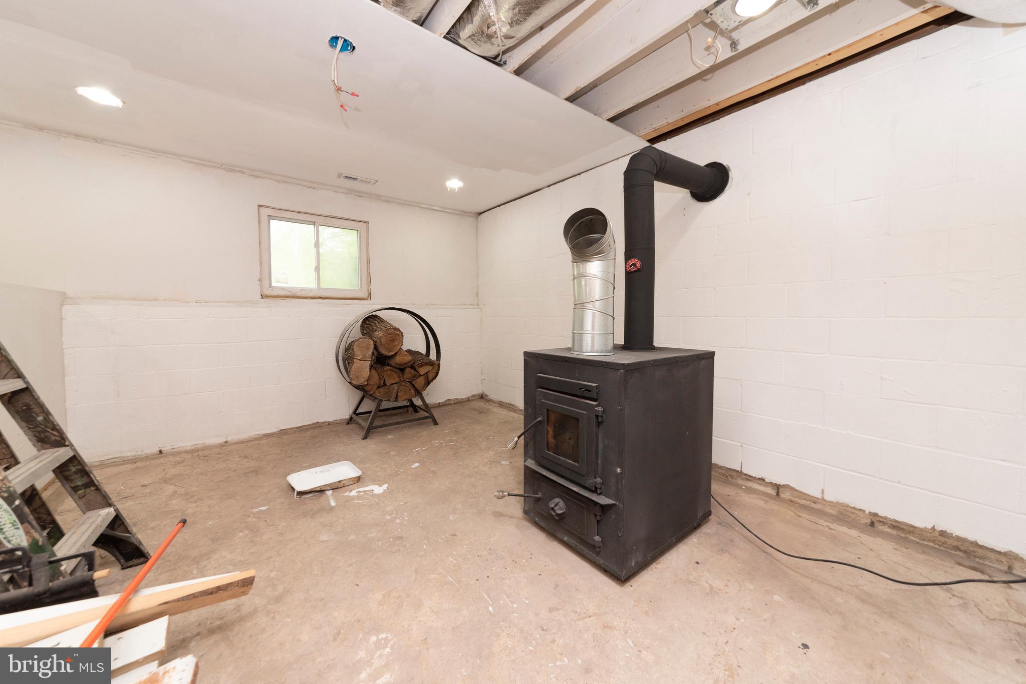 517 Roe Ingleside Road Centreville, MD 21617 - Photo 27 of 57 Wood stove in unfinished basement